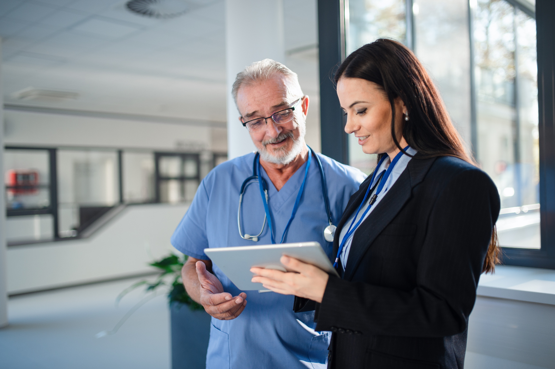 Healthcare leader reviewing information on a tablet