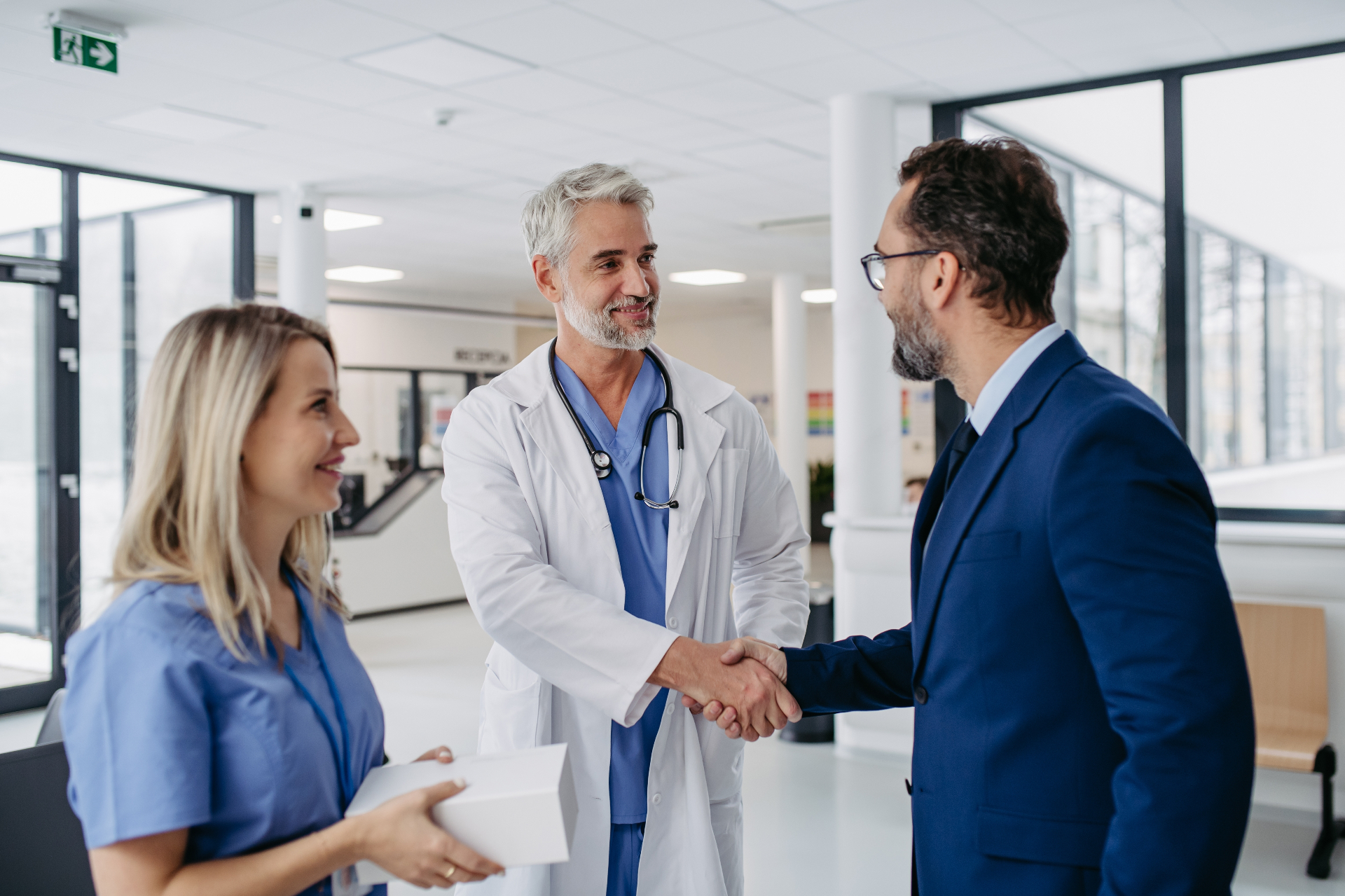 Advisor and doctors shaking hands