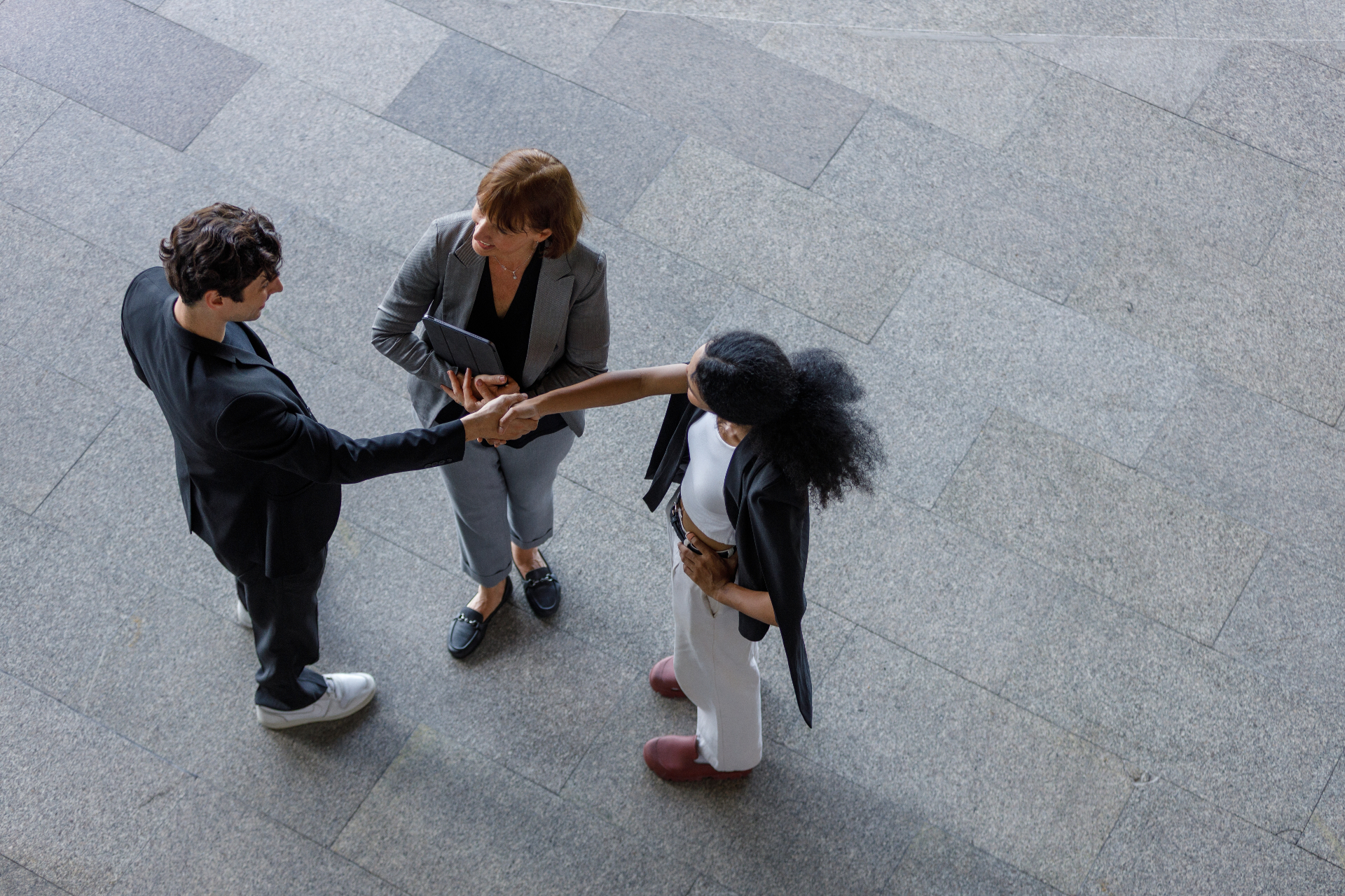 Advisors shaking hands with medical practice partners
